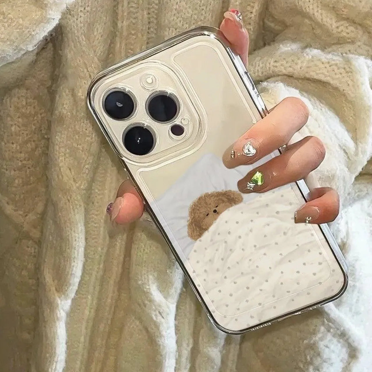 Transparent iPhone case showing sleeping cat pattern on clear TPU material for shockproof protection