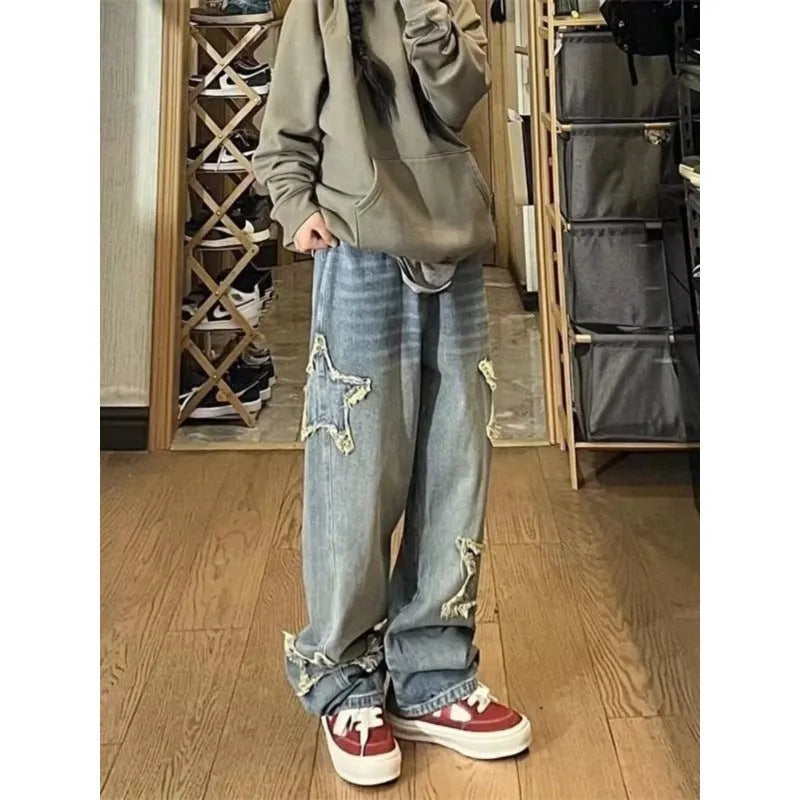 Blue high-waist straight-leg women's jeans on a neutral background.