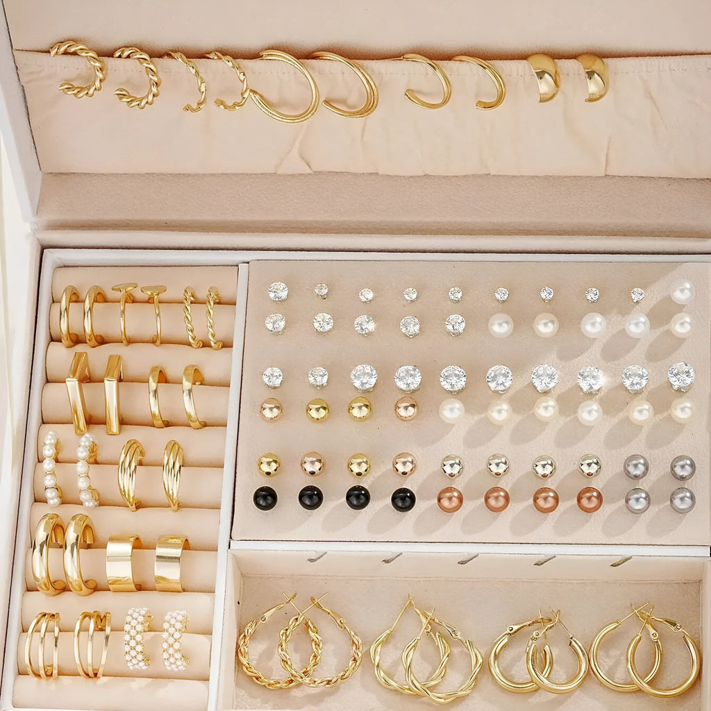 108 geometric alloy earrings with round elements in gold and yellow electroplated finishes