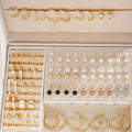 108 geometric alloy earrings with round elements in gold and yellow electroplated finishes