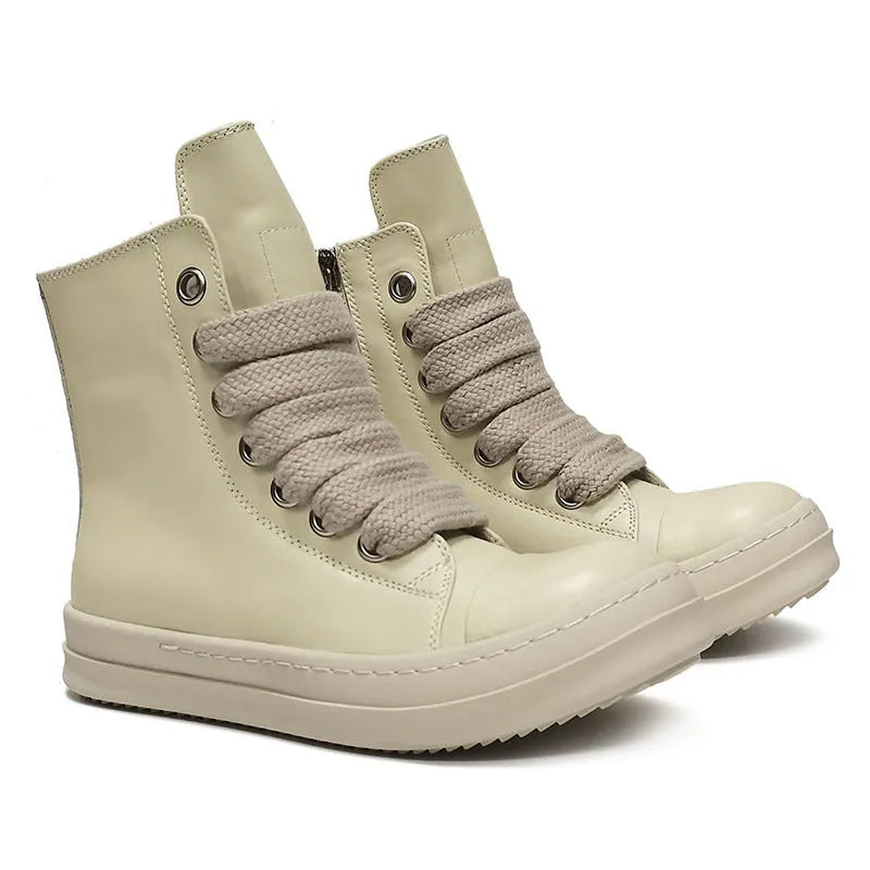 Black high-top leather sneakers with side zipper and round toe on a rubber sole.