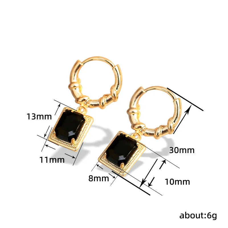 Pair of black geometric French court earrings with zircon stones on copper.