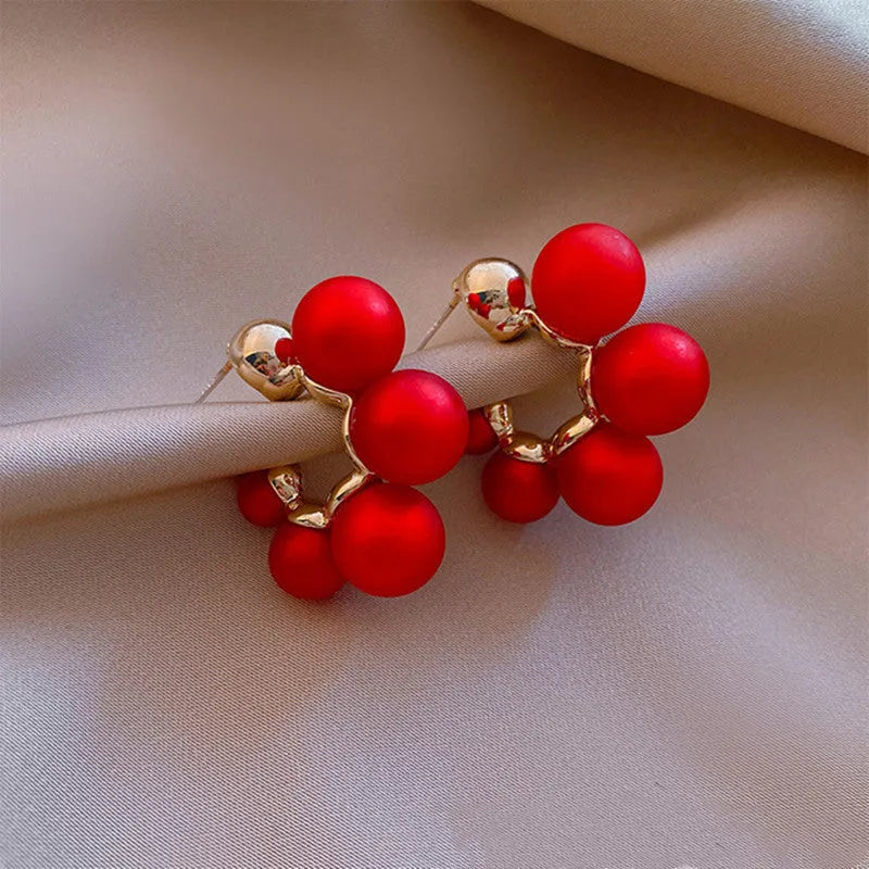 Women's red and white bell-shaped alloy earrings with pendant design