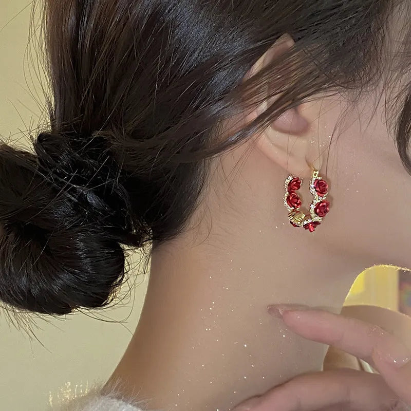 Red flower-shaped alloy clip earrings with rose motif for women