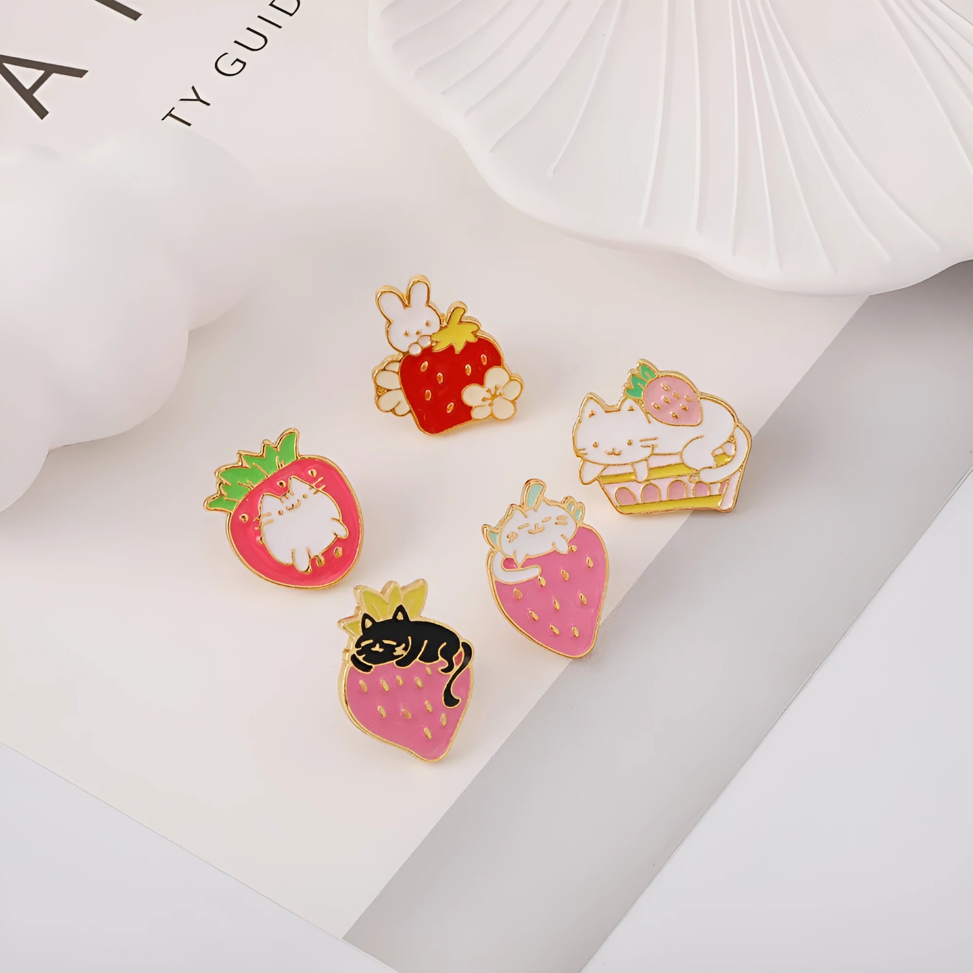 Alloy cake cat brooch with strawberry and dripping oil design in multiple colour options