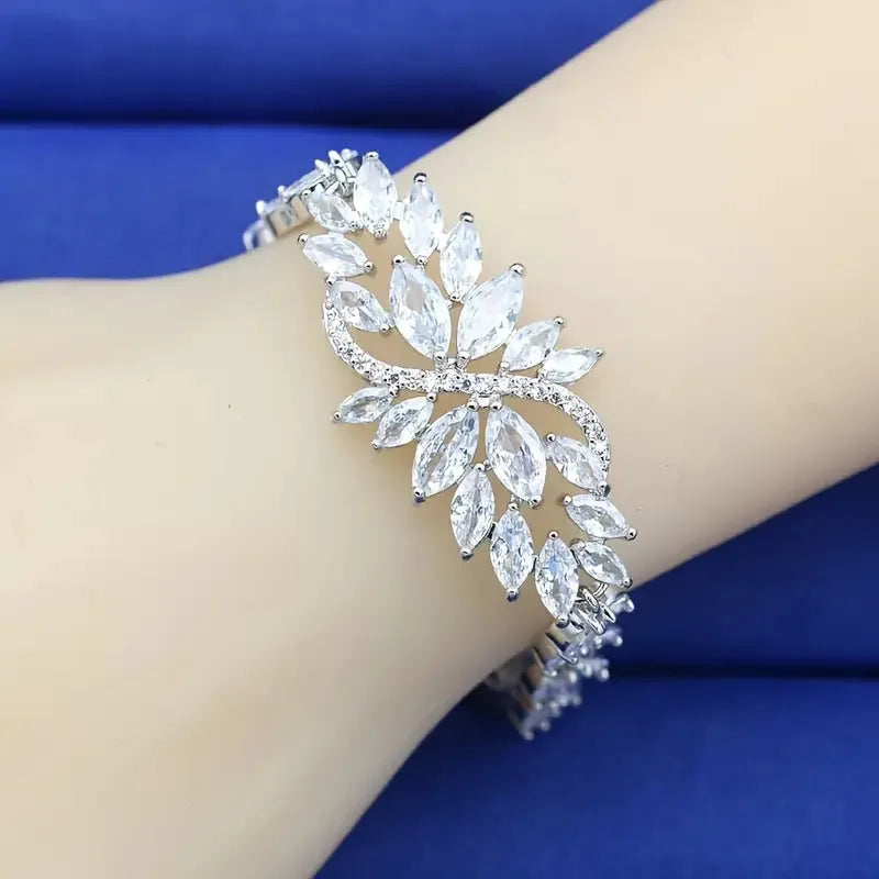 Copper bracelet with gold electroplating and coloured zircon stones in ice flower pattern design