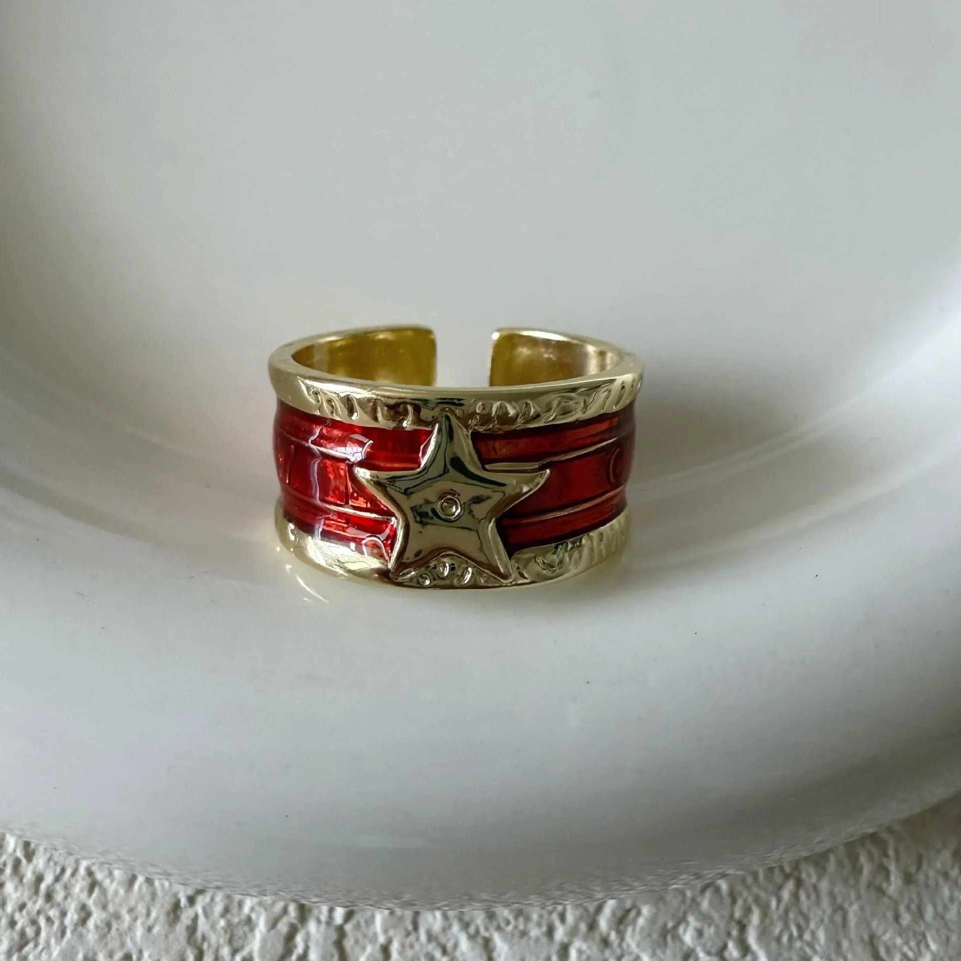 Adjustable copper ring with a geometry shape, distressed finish, and linear design details.