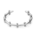C-shaped stainless steel bracelet charm with textured surface and rivet bean beads in metallic finishes