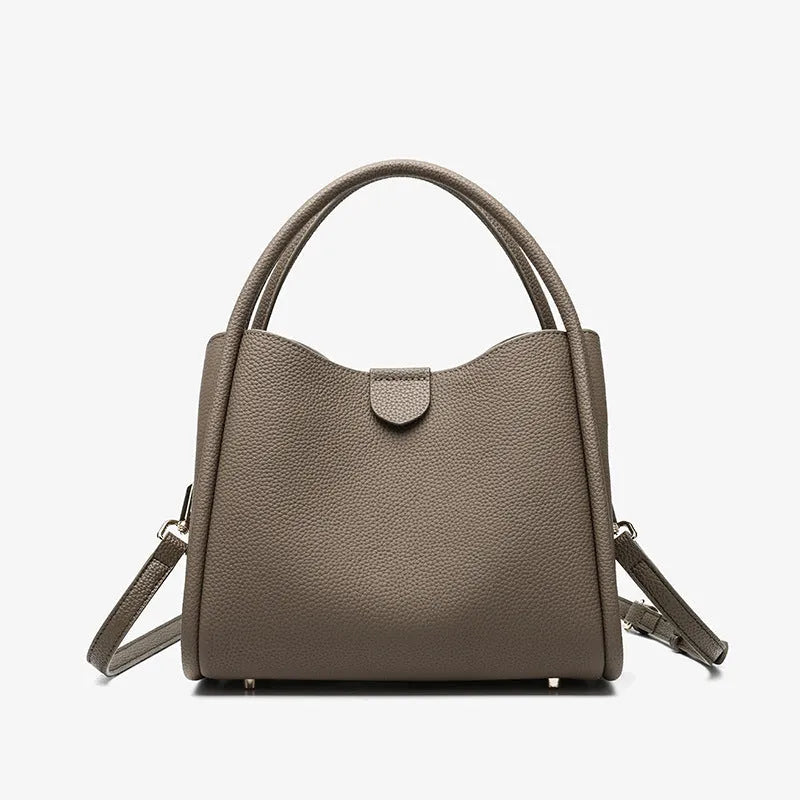 Genuine leather cylindrical handbag in black with open pocket and sewing thread detailing