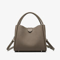 Genuine leather cylindrical handbag in black with open pocket and sewing thread detailing