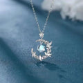 Women's geometric tree and bird pendant necklace with adjustable chain on a blue background.