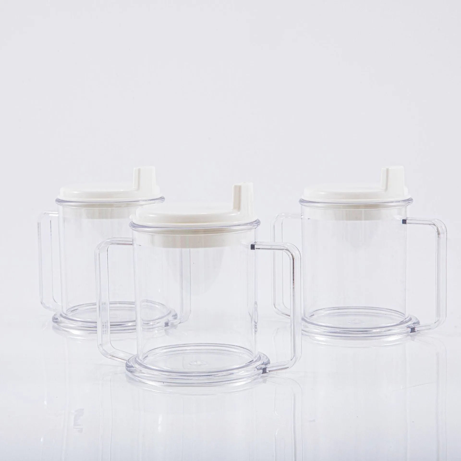 Transparent spill-proof drinking cup with lid showing 14cm height