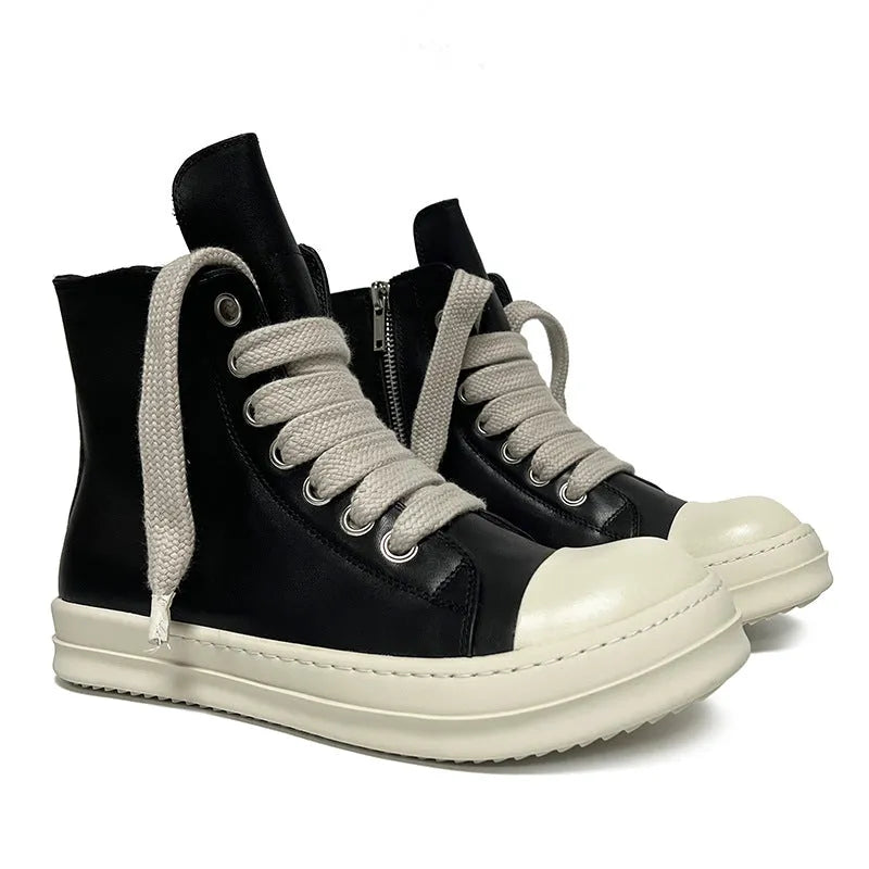 Black high-top leather sneakers with side zipper and round toe on a rubber sole.