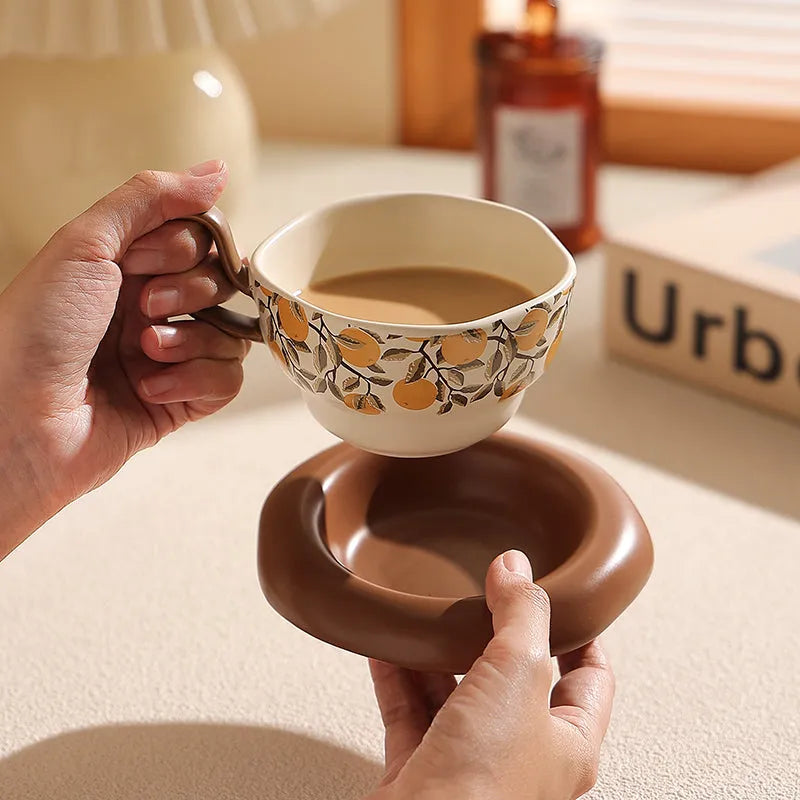 Antique style ceramic coffee cup and saucer set in black or orange, 210ml capacity.