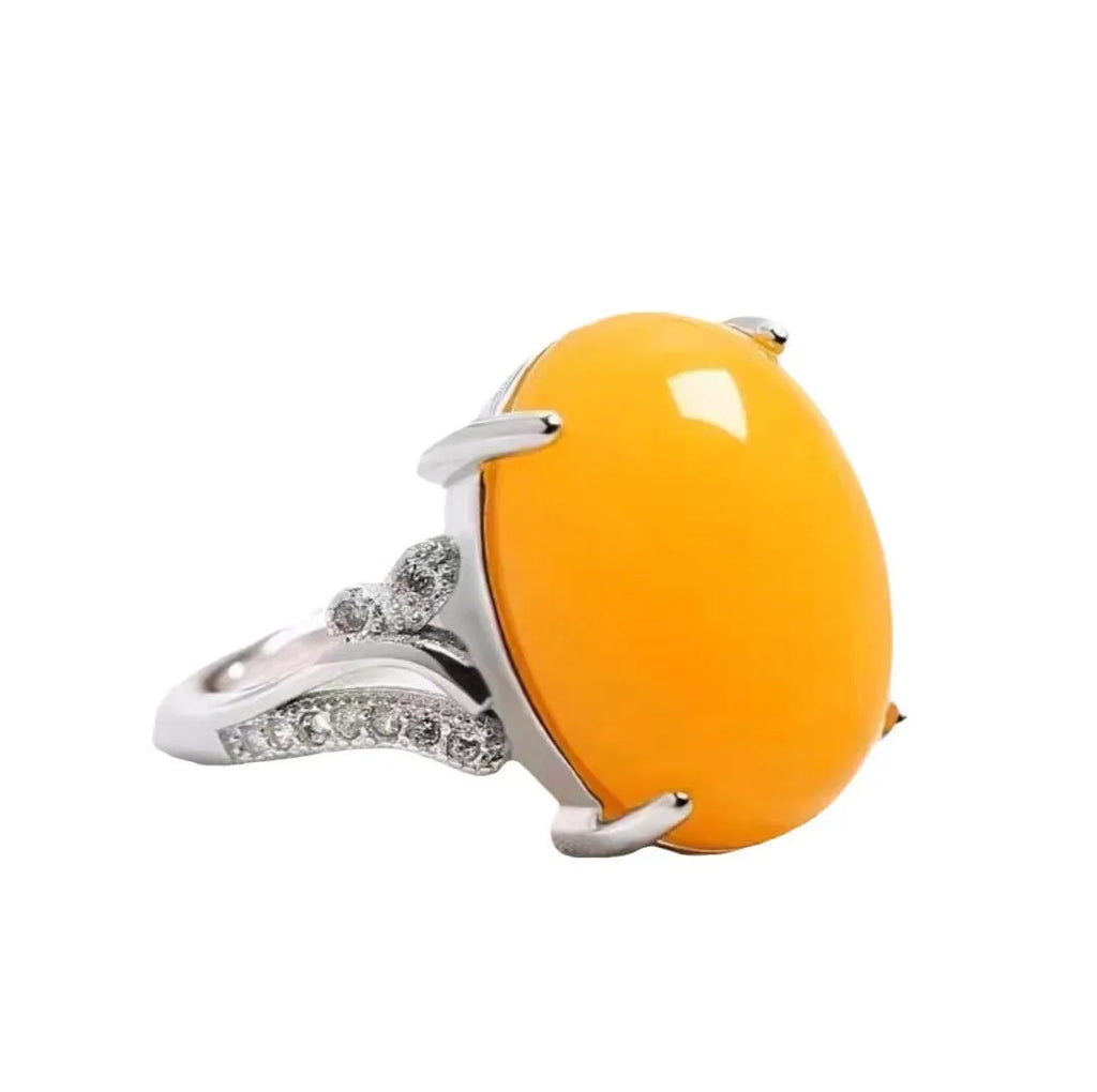 Geometric adjustable alloy ring on a hand, shown in blue finish.