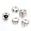 Black alloy ring with a raised retro spade card design on its face.