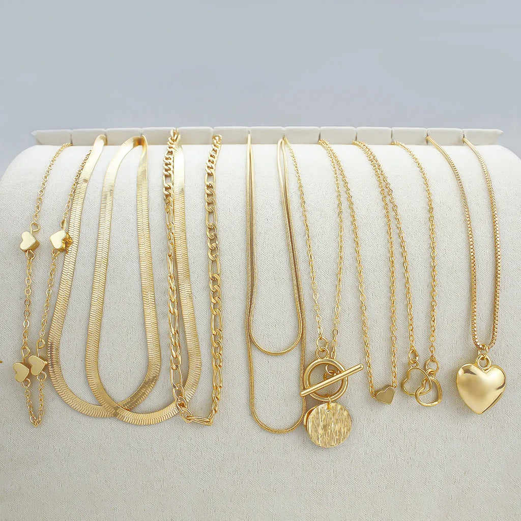 10-piece women's gold necklace set with snake bone chain and alloy pendants