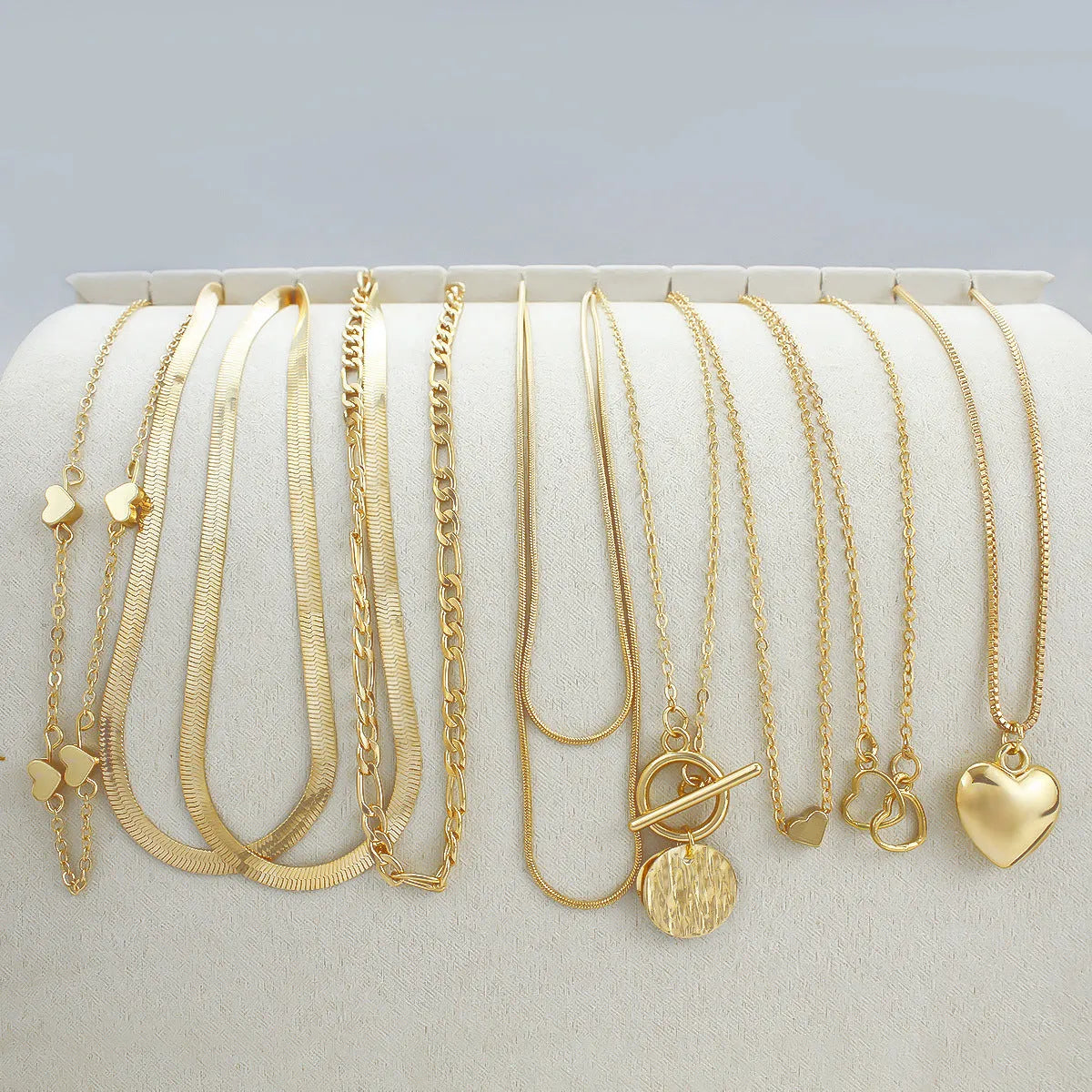 10-piece women's gold necklace set with snake bone chain and alloy pendants
