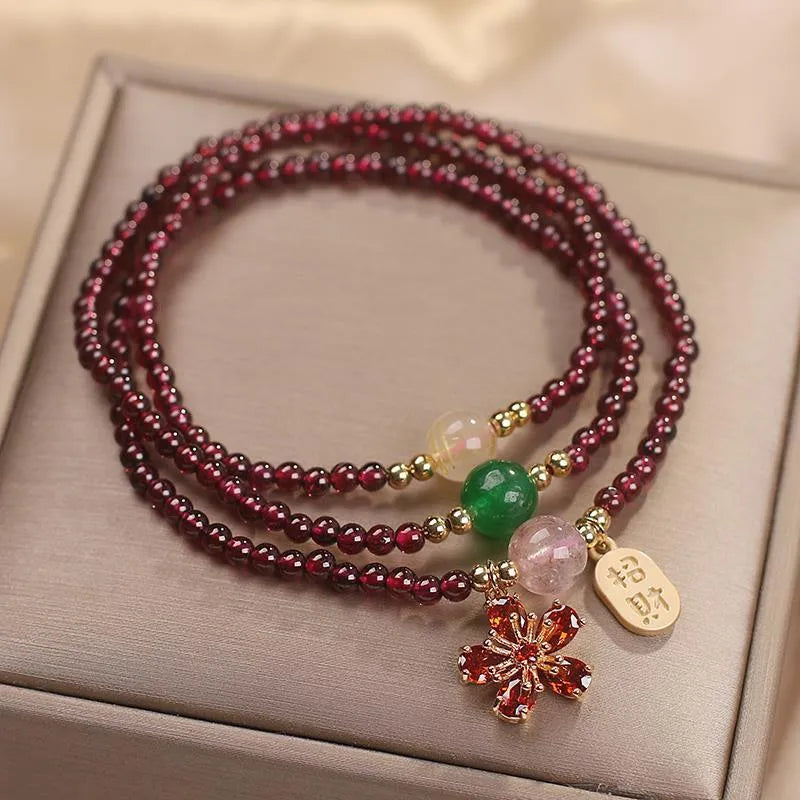 Natural crystal women's bracelet in pomegranate red cherry blossom colour with sequin detail