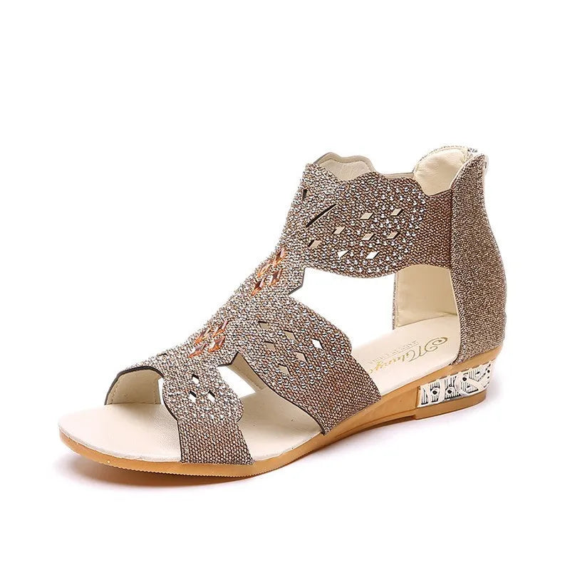 Women's flat black sandals with rhinestone details and a back zipper closure
