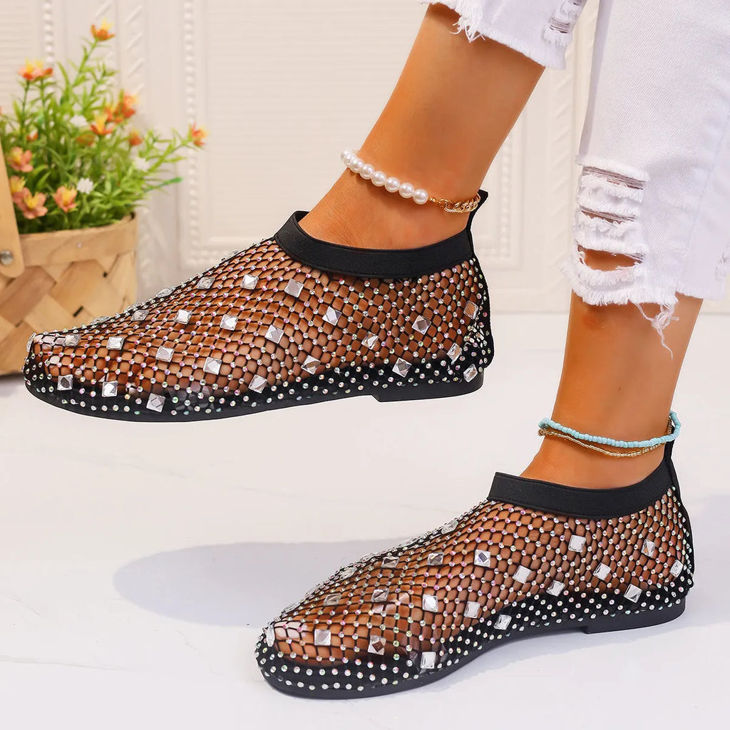 Women's colourful rhinestone mesh flat sandals on white background showing round toe design