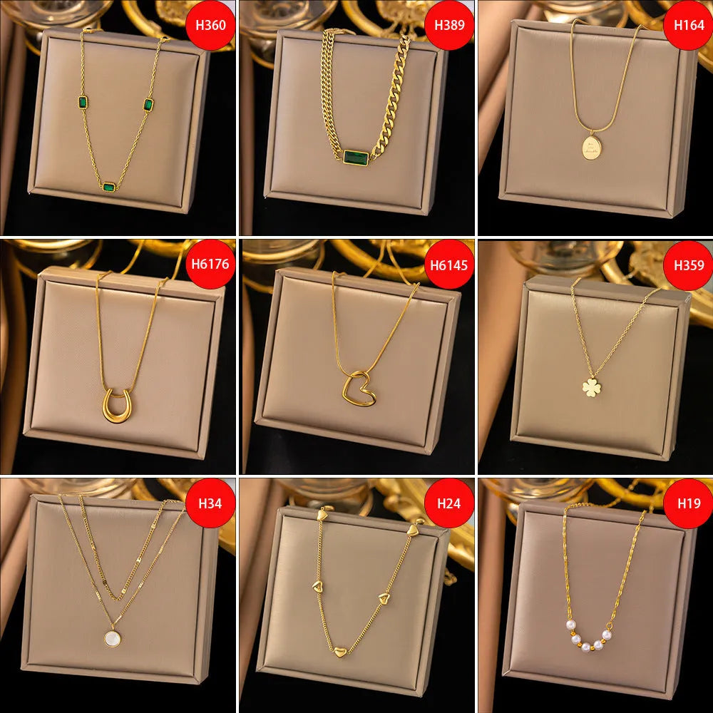 Gold titanium steel necklace with double ring pendant on a regular chain, listed as 37 H6012