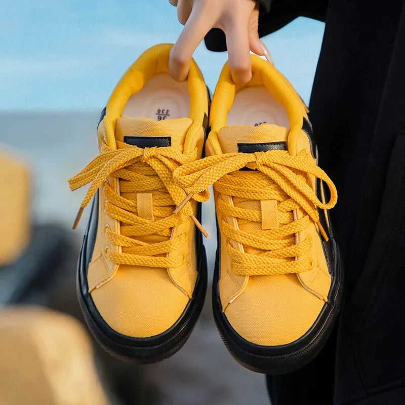 Women's low-top lace-up board shoes with vulcanised rubber sole and round toe in multiple colour options.