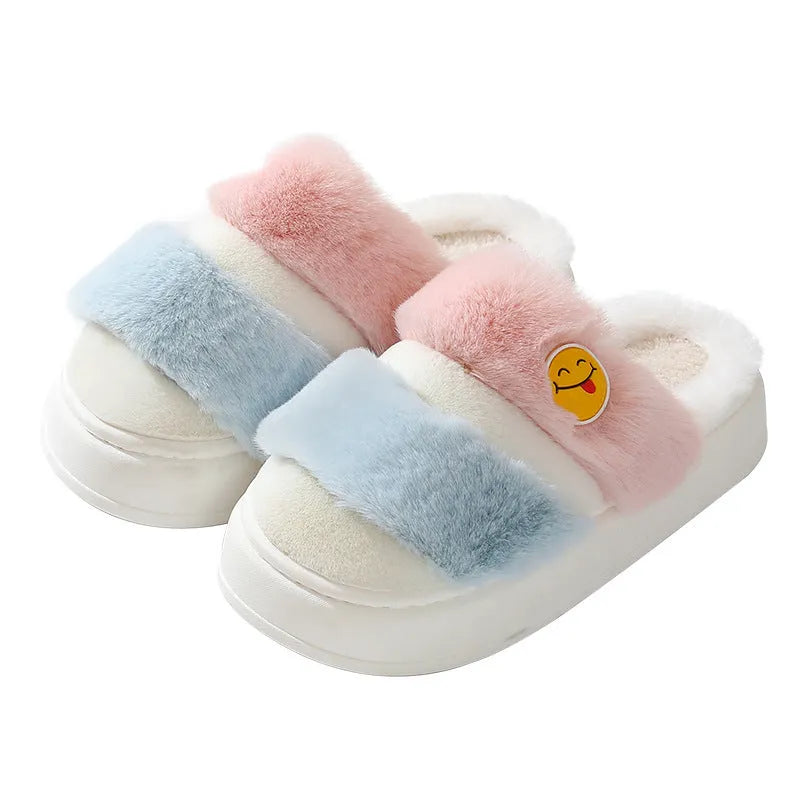 A pair of pink and green thermal cotton overshoe slippers with plush exterior and cashmere lining.