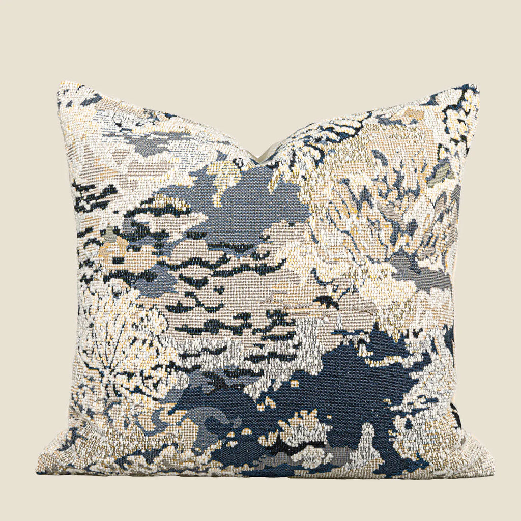 Antique blue floral patterned pillow on a sofa, shown in square and rectangular waist pillow sizes.