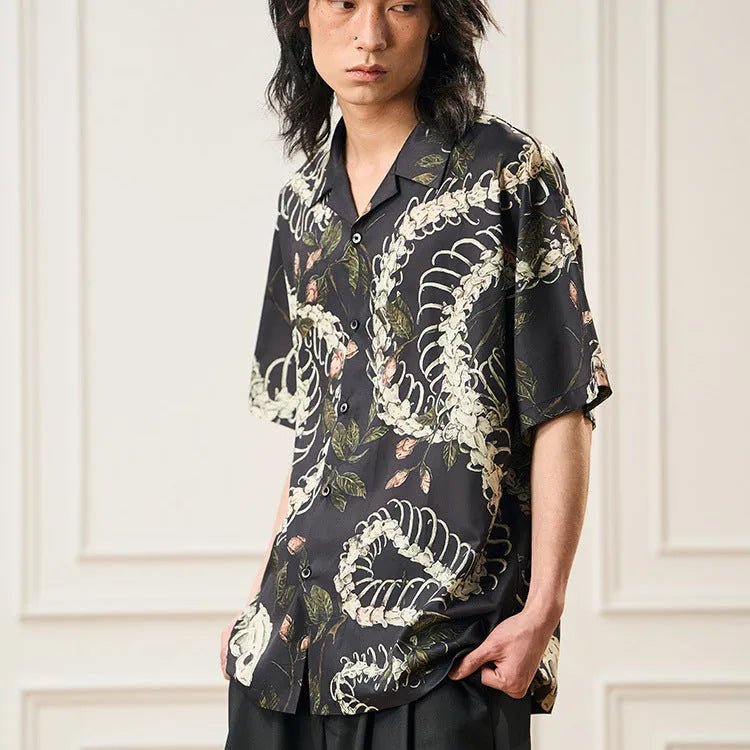 Short sleeve Cuban collar shirt featuring a printed snake bone and flower pattern in a loose fit.