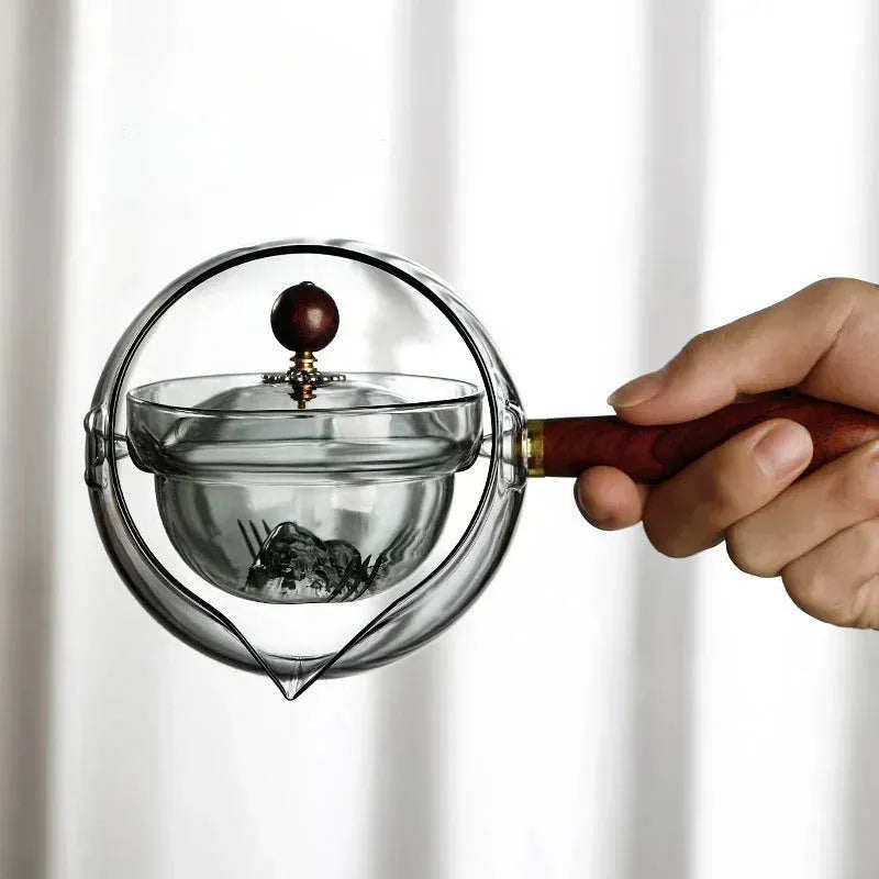 Transparent borosilicate glass teapot with wooden handle and removable infuser for rotary tea brewing