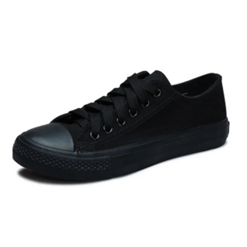 Women's solid colour casual canvas shoes in a lace-up style on a white background.