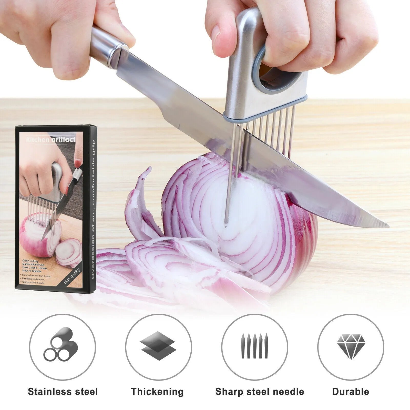 Stainless steel onion holder with sharp prongs and a red finger guard on a kitchen counter.
