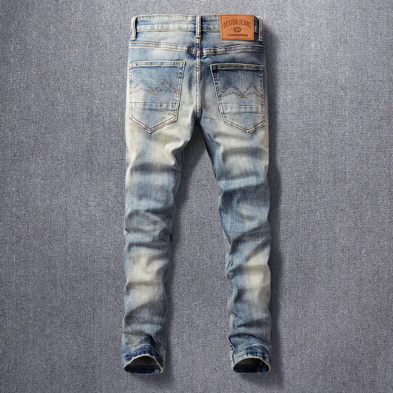 Men's retro straight-leg jeans in distressed blue washed denim with mid waist, zip fly and multiple pockets