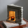 Wukang Building concrete wax lamp in white with Nordic style on a table in a living room