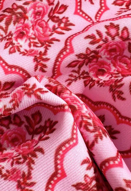 Pink printed two-piece swimsuit with shoulder straps and exposed back, top and shorts set, sizes S M L XL