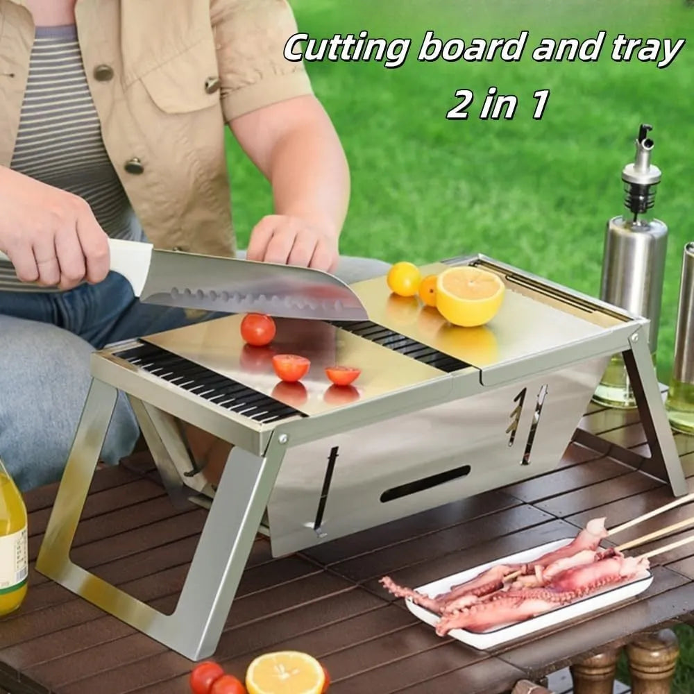 Small foldable portable steel charcoal grill for outdoor use.
