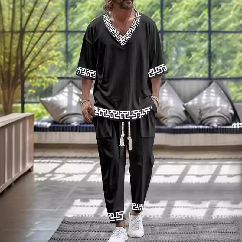 V-neck cropped sleeve jacket and matching trousers suit in a thin polyester fabric