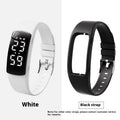 Vibration alarm clock watch with LED display and coloured silicone strap on a wrist.