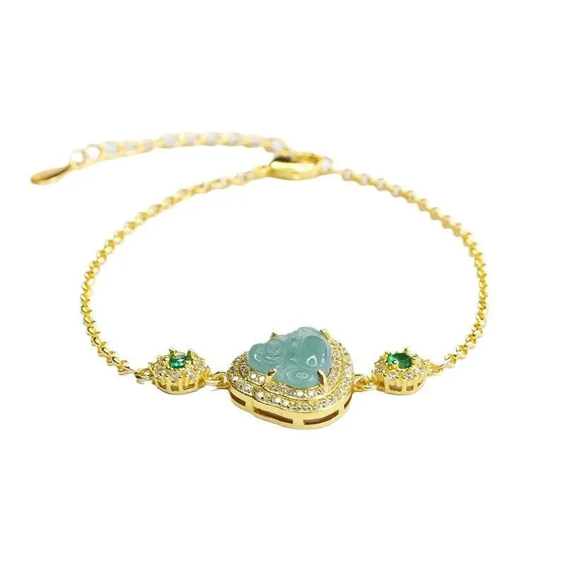 Women's jade bracelet with an inlaid blue Maitreya Buddha charm measuring 10mm by 13mm.