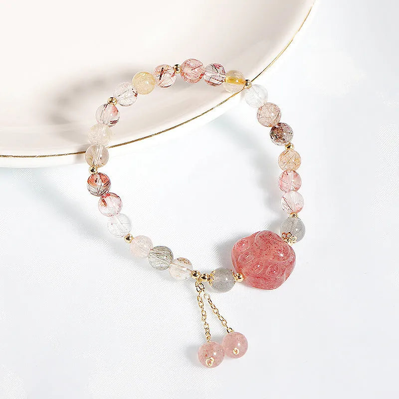 Women's natural crystal bracelet with manual craftsmanship showing animal zodiac designs