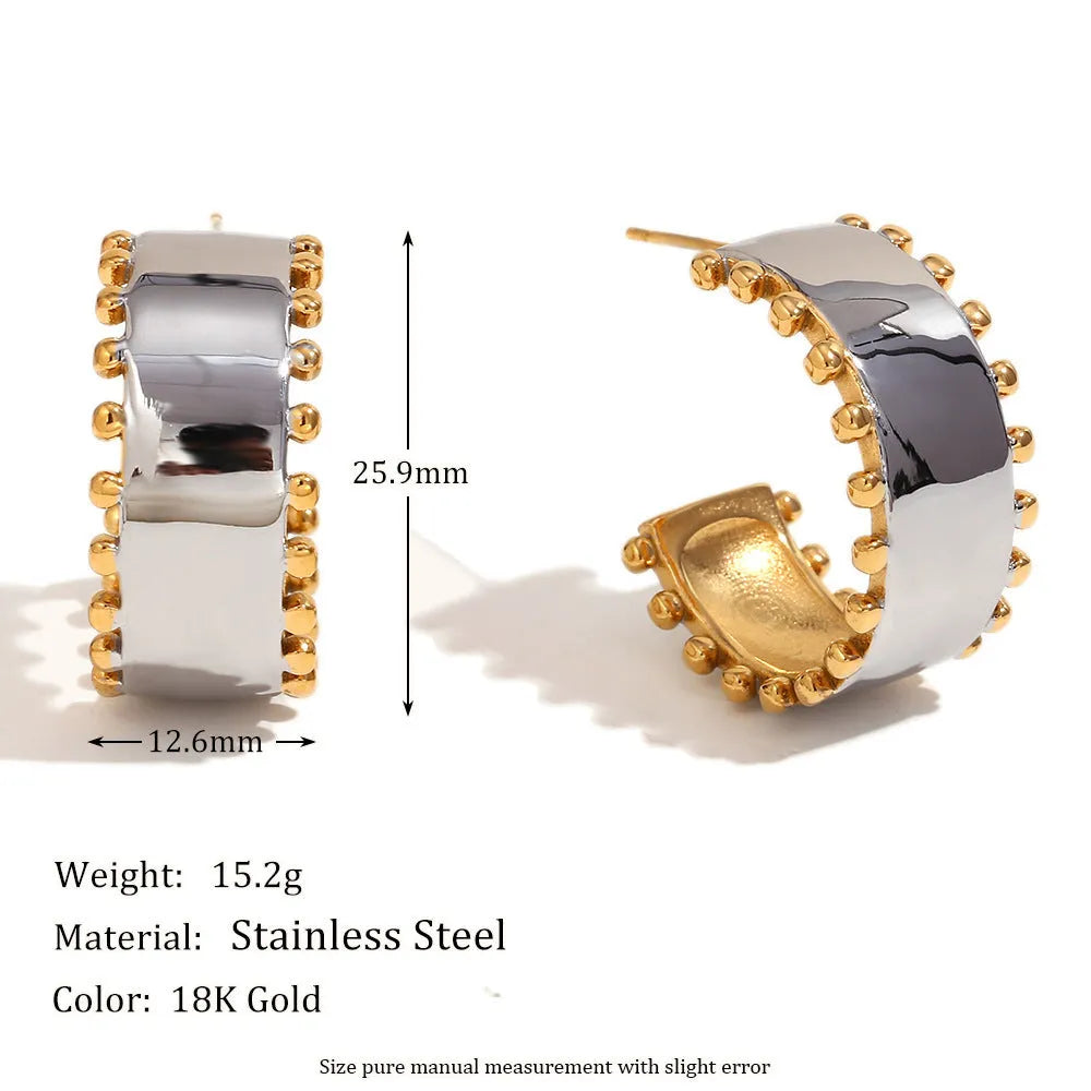 Gold electroplated stainless steel jewellery set with geometric earrings, necklace, and bracelet.