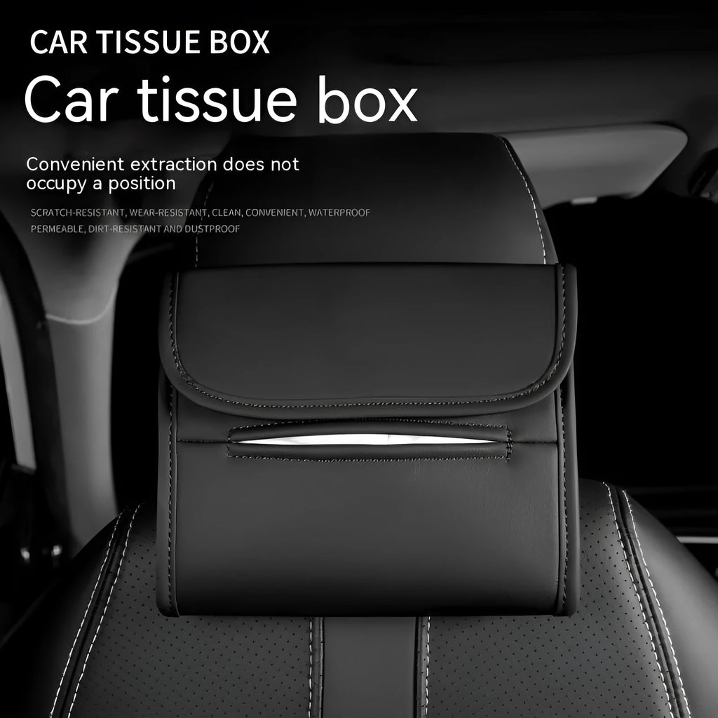 Brown leather car tissue box with elastic strap hanging on a car seat back.