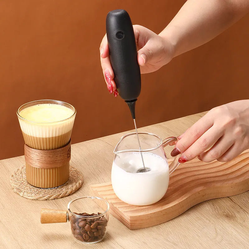 Electric hand-held milk frother in modern simplicity design for coffee preparation