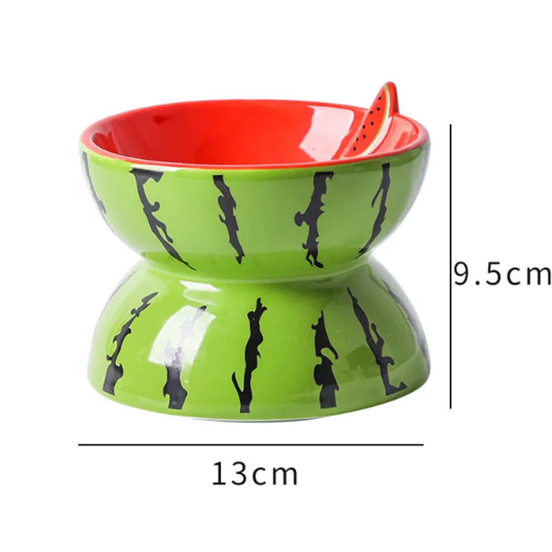 Ceramic elevated cat bowl with tilted wide dish in a colourful fruit pattern.