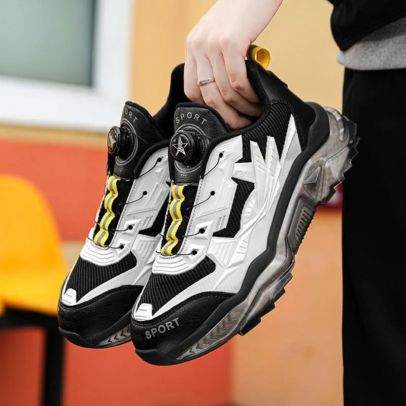 Men's black casual shoes with rotating button fastening and a low platform sole.