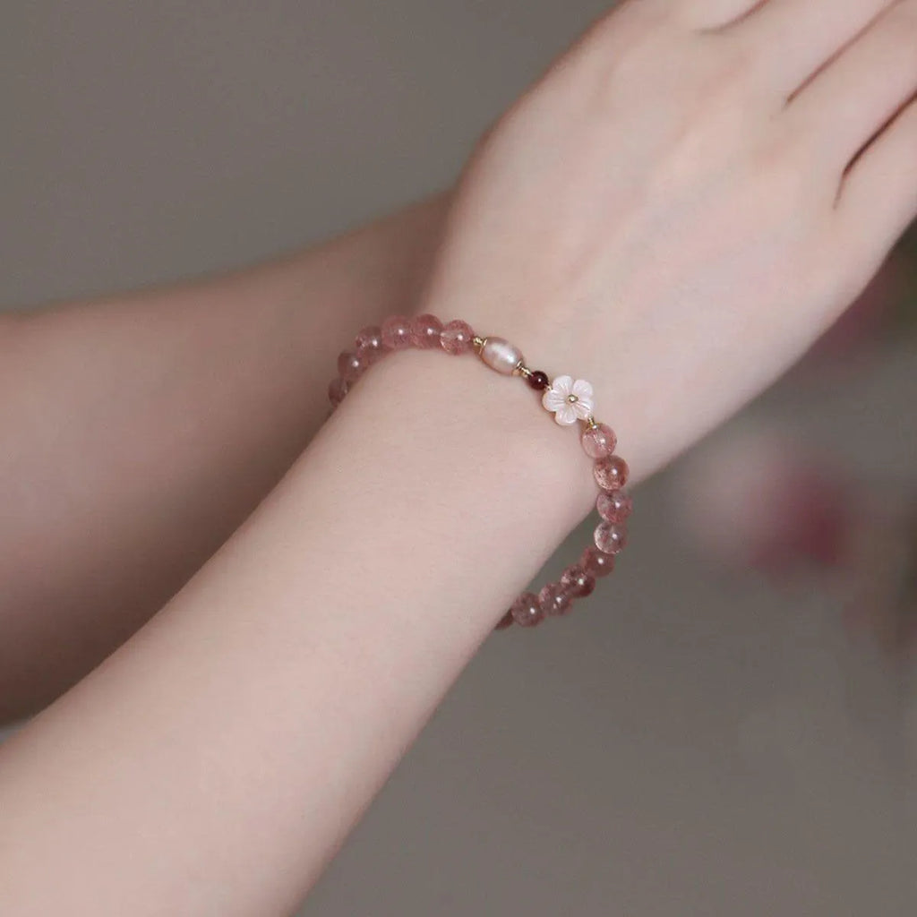 Strawberry quartz crystal bracelet with peach blossom flower charm design on adjustable chain