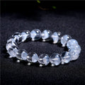 Women's white crystal bracelet with natural ghost pyramid shapes and Ruyi design elements