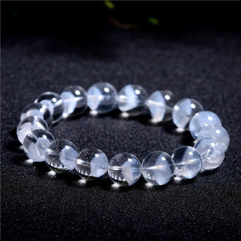 Women's white crystal bracelet with natural ghost pyramid shapes and Ruyi design elements