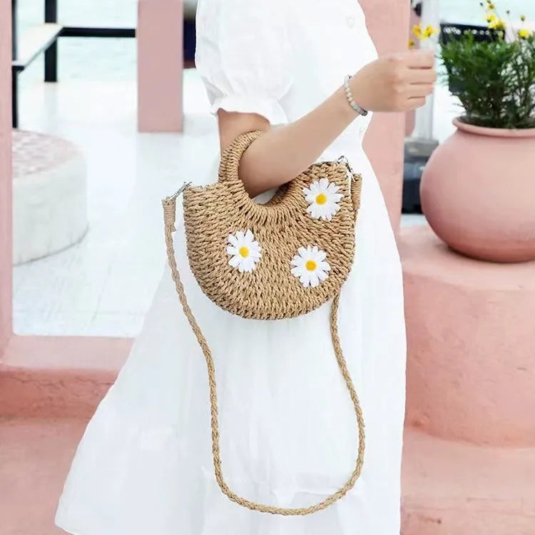 Women's light brown straw-weaved crossbody bag with daisy decoration measuring 25x20x8cm